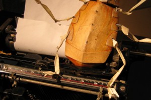 Cockroach puppet on an old manual typewriter